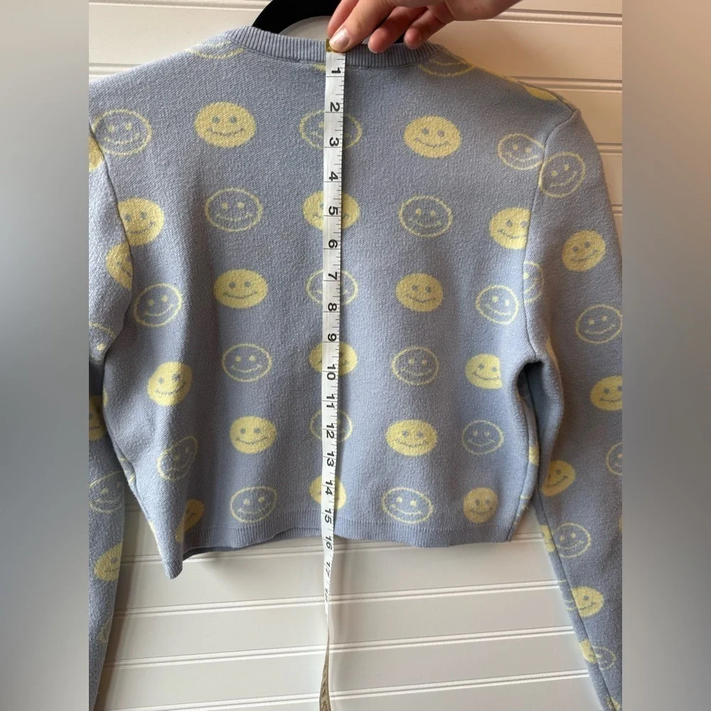 Bailey Rose cropped preppy smiley face sweater. Juniors size large.